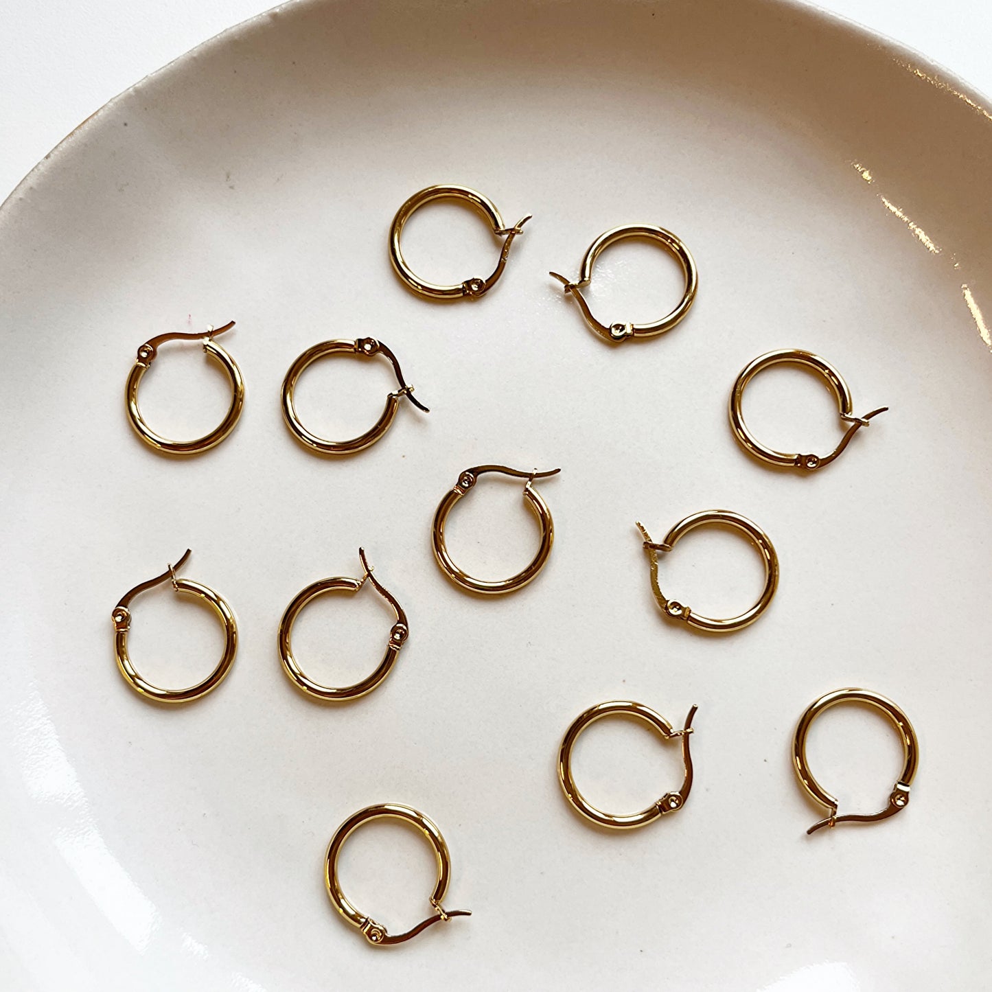 Huggie rond met clip-sluiting goud