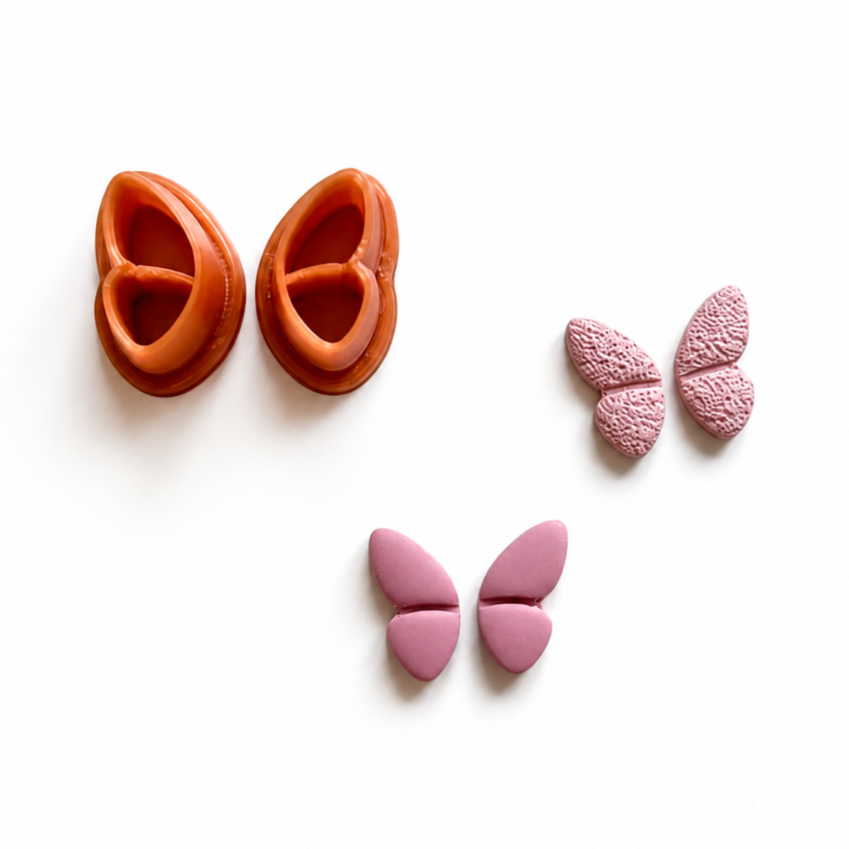 roze polymeerklei oorbellen gemaakt met vlinder cutter